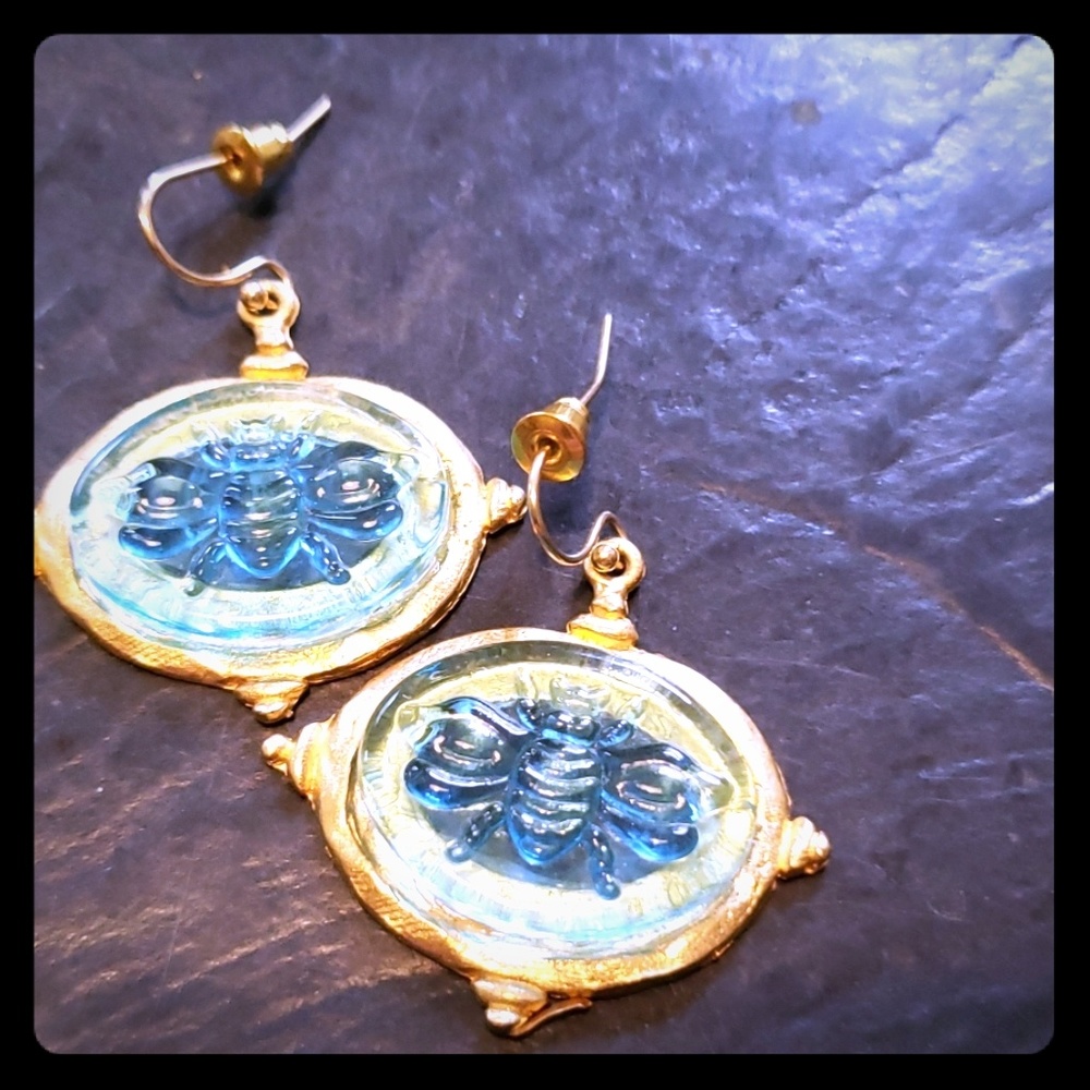 Gold tone and glass earring